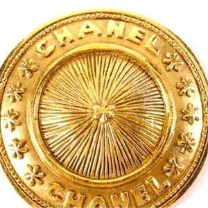 Vintage gold Chanel Brooch.